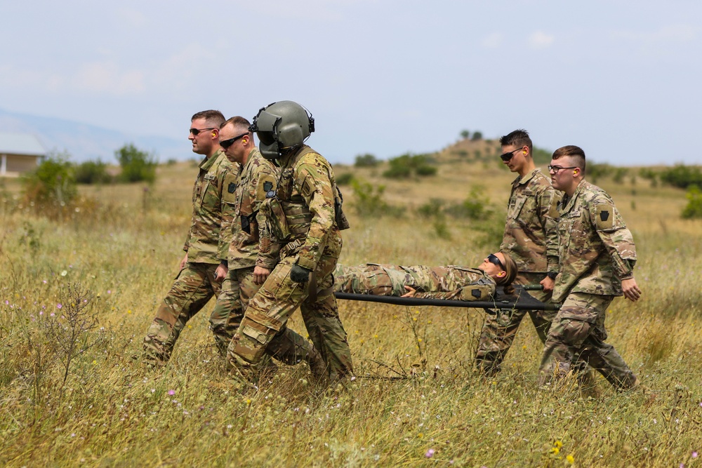 Medics of the 2-112th headquarters company practice cold and hot load training aboard Blackhawk