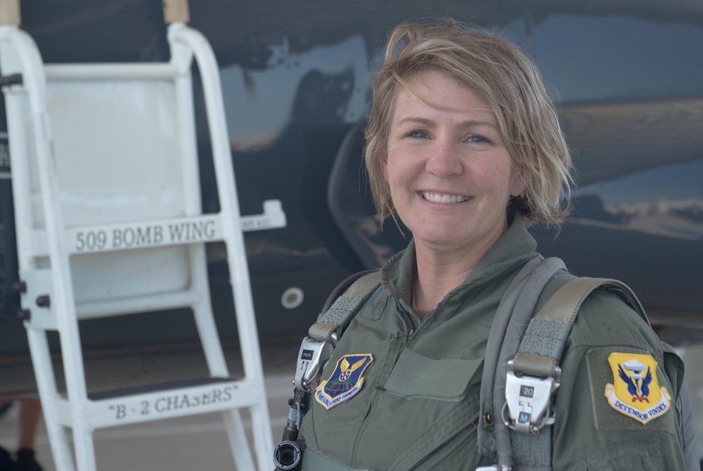 Chief Master Sergeant Katie McCool poses in front of the T-38 Trainer Aircraft after her Incentive Flight