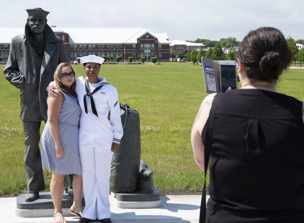 New Sailors Pose with Lone Sailor Statue at Recruit Training Command