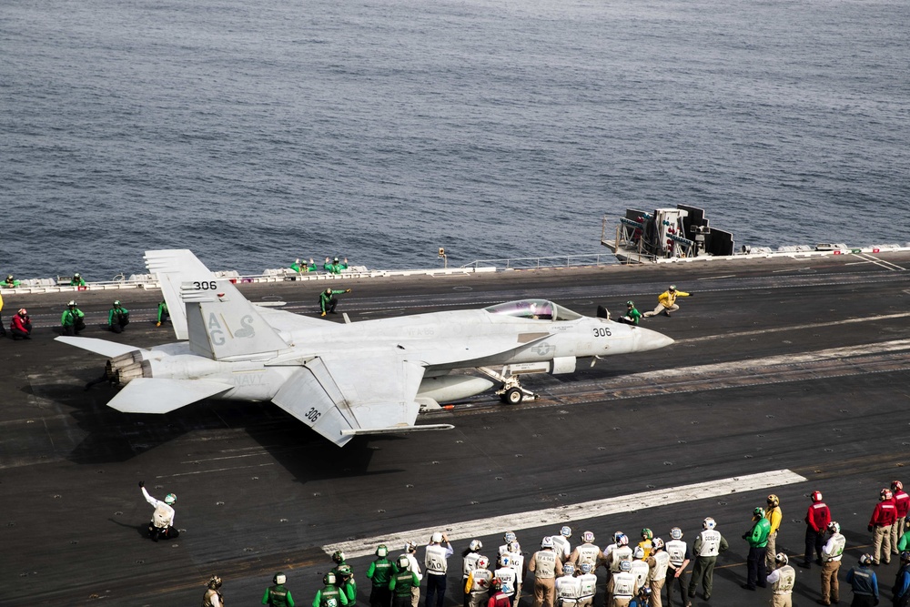 An F/A-18E Super Hornet launches from the flight deck of the Nimitz-class aircraft carrier USS Abraham Lincoln (CVN 72).