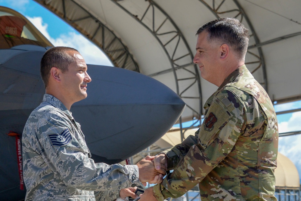 134th Airman gets promoted in front of F-22 Raptor in Hawaii