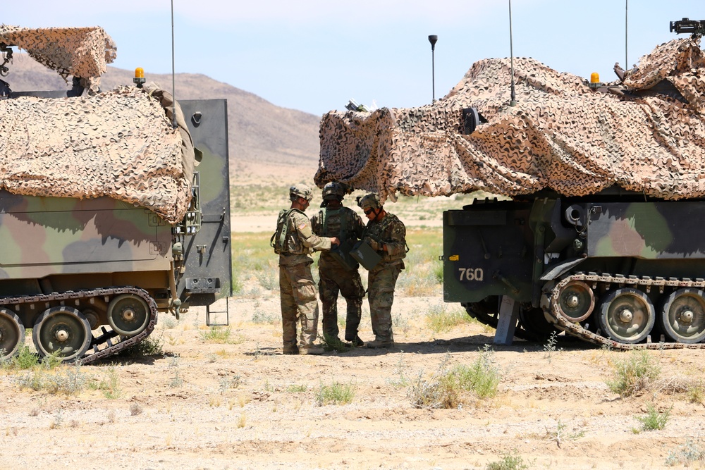 1-113th Field Artillery Soldiers conduct calibration at the National Training Center