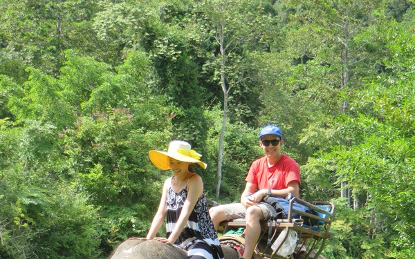 FED employee rides elephant in Korea