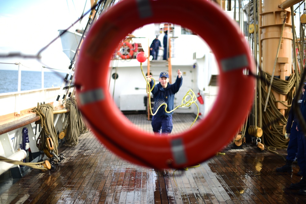 Coast Guard First Class Cadet David Denmark participates in damage control olympics on the Eagle