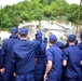 Coast Guard Cadets aboard the U.S. Coast Guard Tall Ship Eagle wave to crowds of people in France