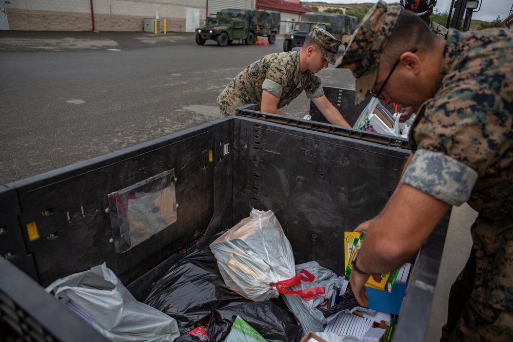 1st Radio Battalion hikes with school supply donations for local school