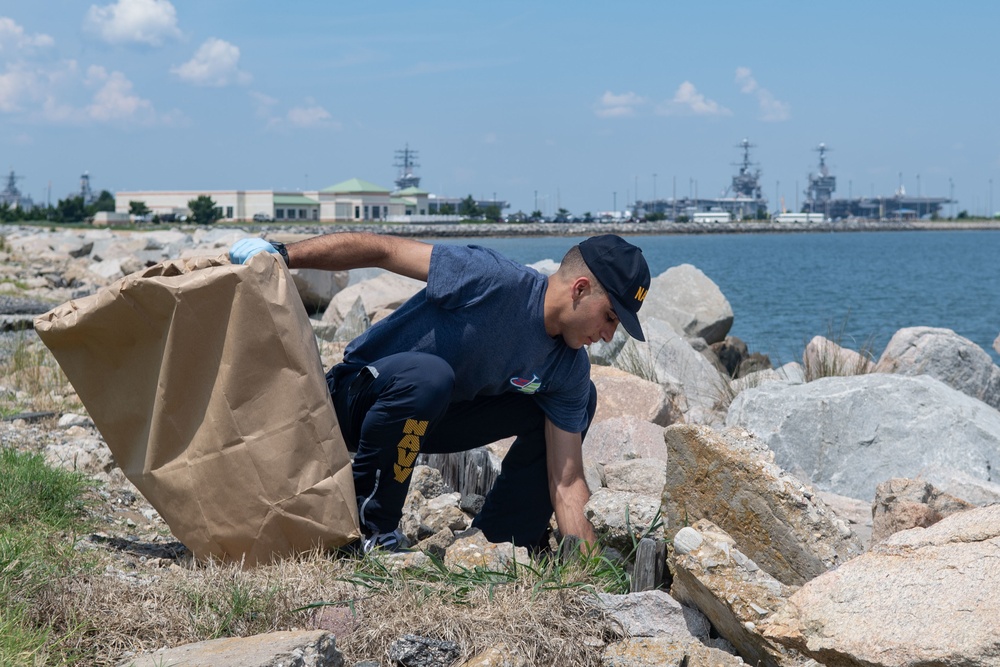 U.S. Sailor participates in a base cleanup project
