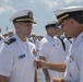 Admiral John Aquilino, Commander, Pacific FLeet, awards a Sailor during an awards ceremony on USS John S. McCain (DDG 56)