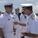 Admiral John Aquilino, Commander, Pacific FLeet, awards a Sailor during an awards ceremony on USS John S. McCain (DDG 56)