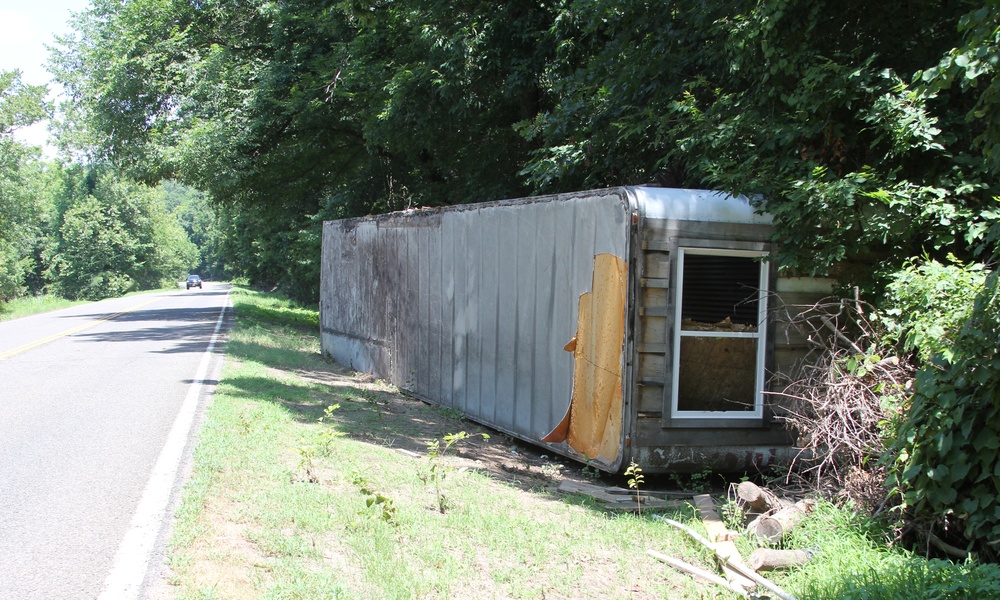 Mobile Home Washed Across a Road