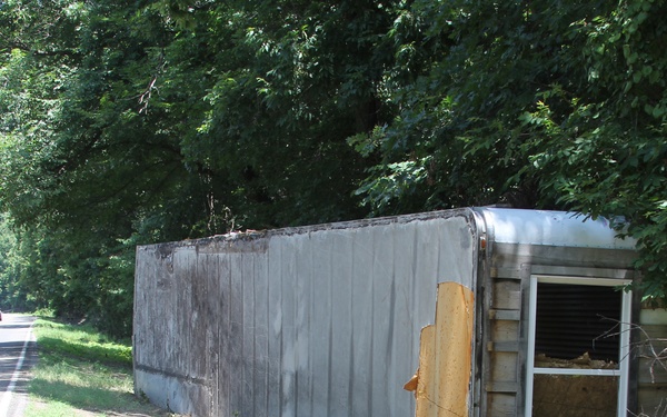 Mobile Home Washed Across a Road