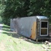 Mobile Home Washed Across a Road