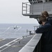 Nimitz Sailors Observe Aircraft Take Off