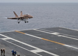 Hornet Lands On Flight Deck of Nimitz