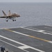 Hornet Lands On Flight Deck of Nimitz