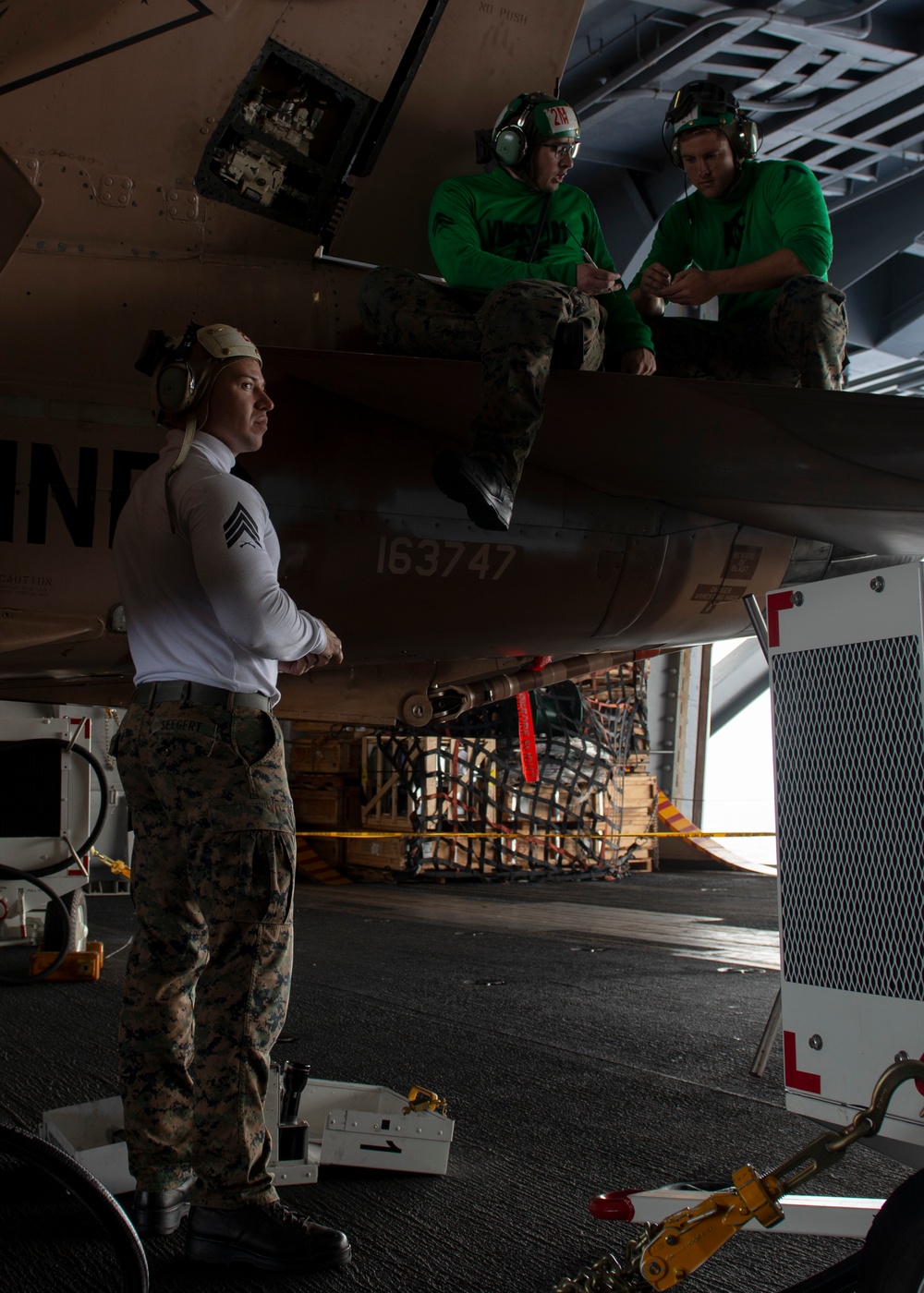 Marines Conduct Maintenance on Aircraft