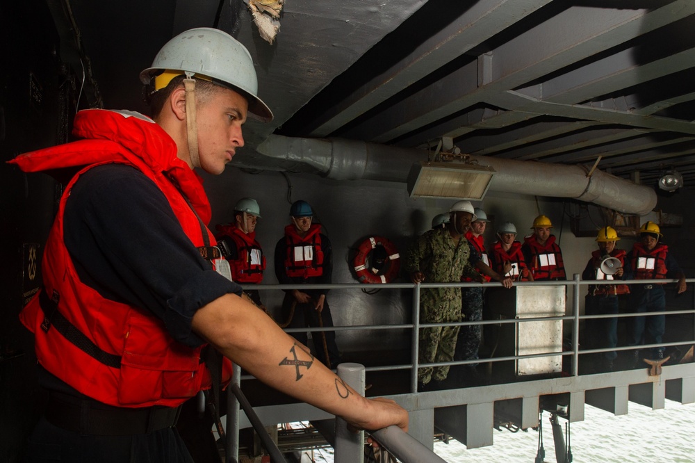 U.S. Sailors operate a rigid-hull inflatable boat