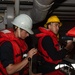 U.S. Sailors operate a rigid-hull inflatable boat