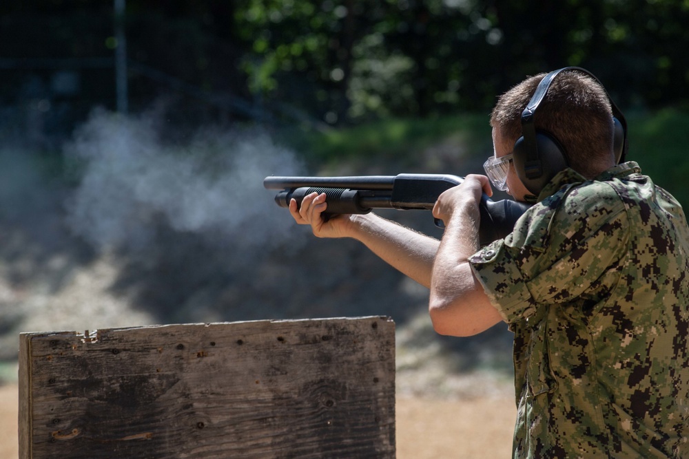 U.S. Sailors attend an M500 shotgun qualification course