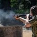 U.S. Sailors attend an M500 shotgun qualification course