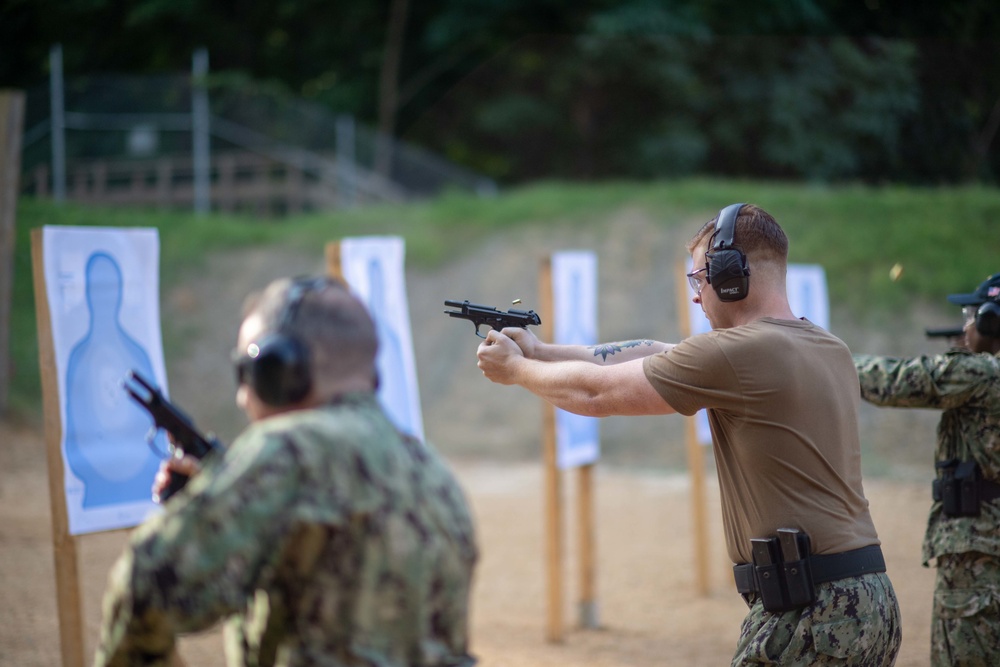 U.S. Sailors attend an M9 pistol qualification course