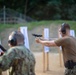 U.S. Sailors attend an M9 pistol qualification course