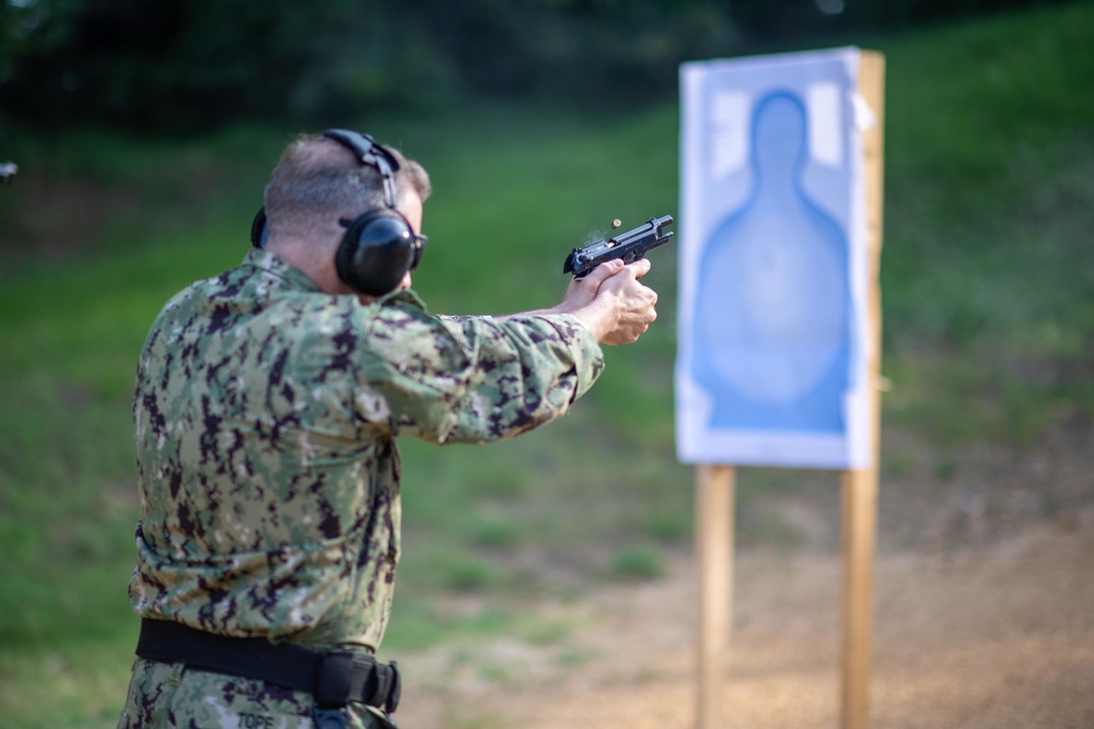 U.S. Sailors attend an M9 pistol qualification course