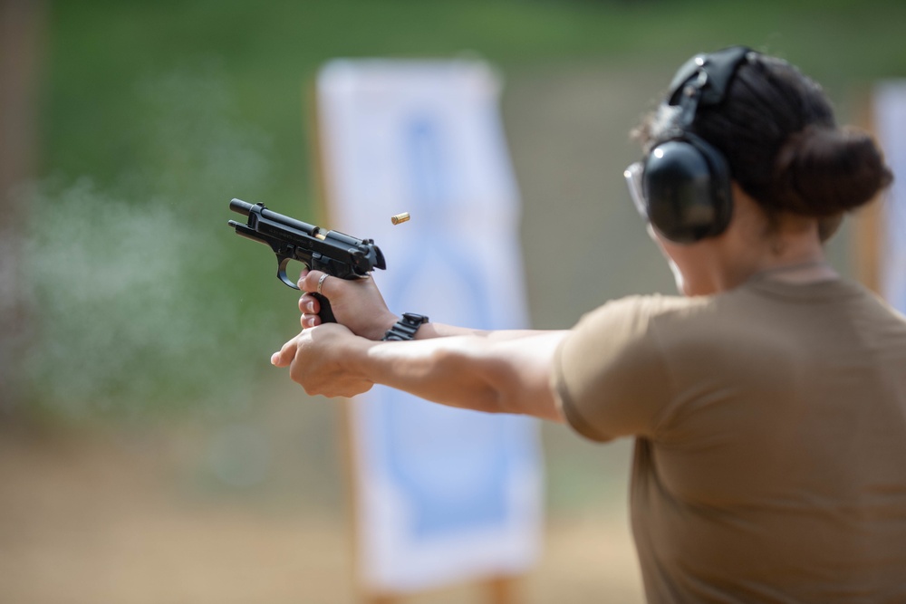 U.S. Sailors attend an M9 pistol qualification course