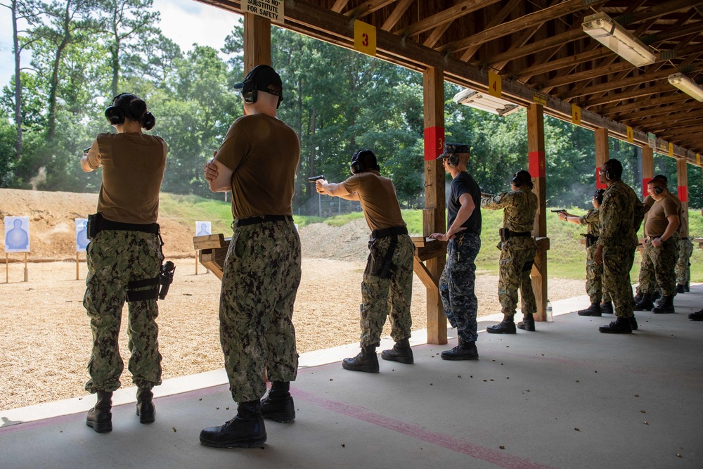 U.S. Sailors attend an M9 pistol qualification course