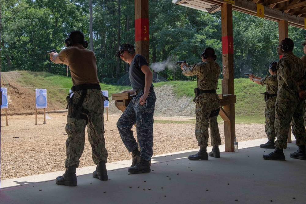 U.S. Sailors attend an M9 pistol qualification course