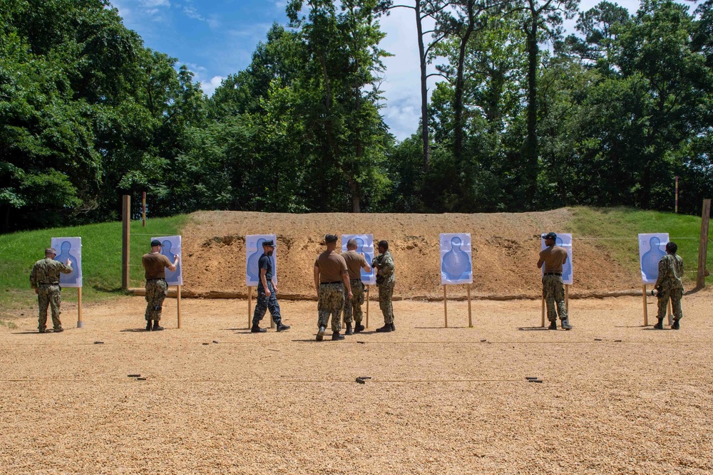 U.S. Sailors attend an M9 pistol qualification course