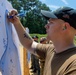 U.S. Sailors attend an M9 pistol qualification course