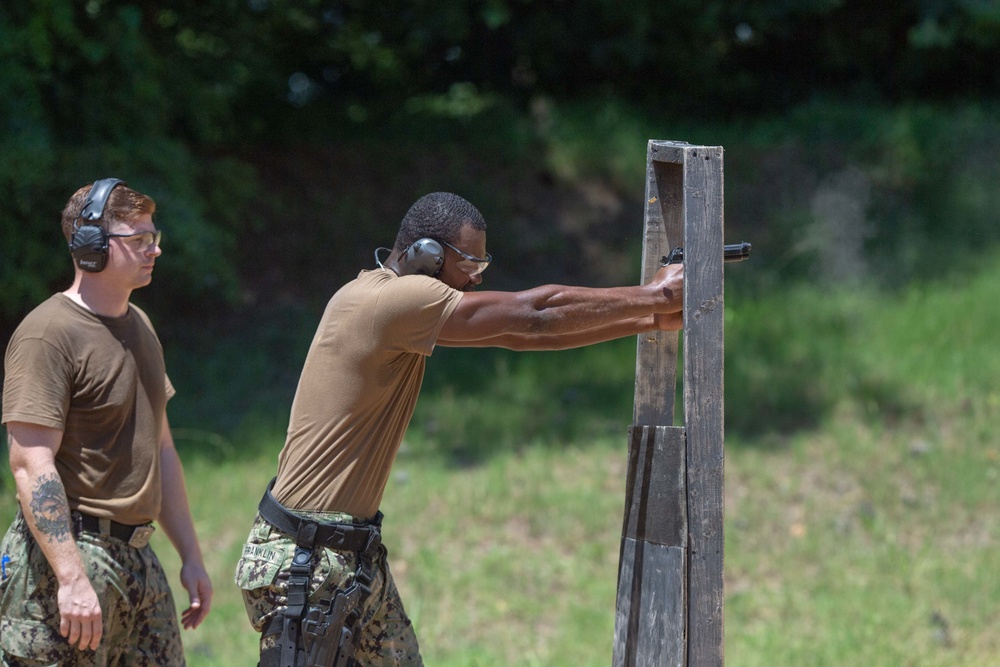 U.S. Sailors attend an M9 pistol qualification course