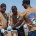 U.S. Sailors participate in a base cleanup project