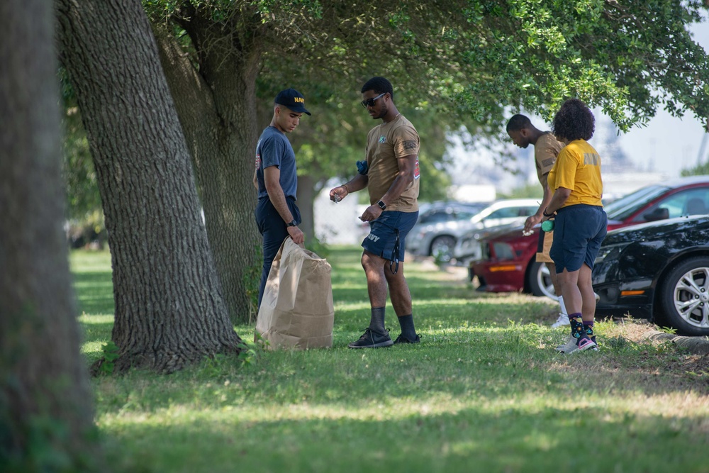 U.S. Sailors participate in a base cleanup project