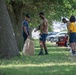 U.S. Sailors participate in a base cleanup project