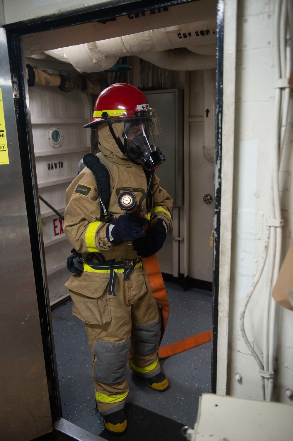 U.S. Sailor participates in a simulated general quarters drill