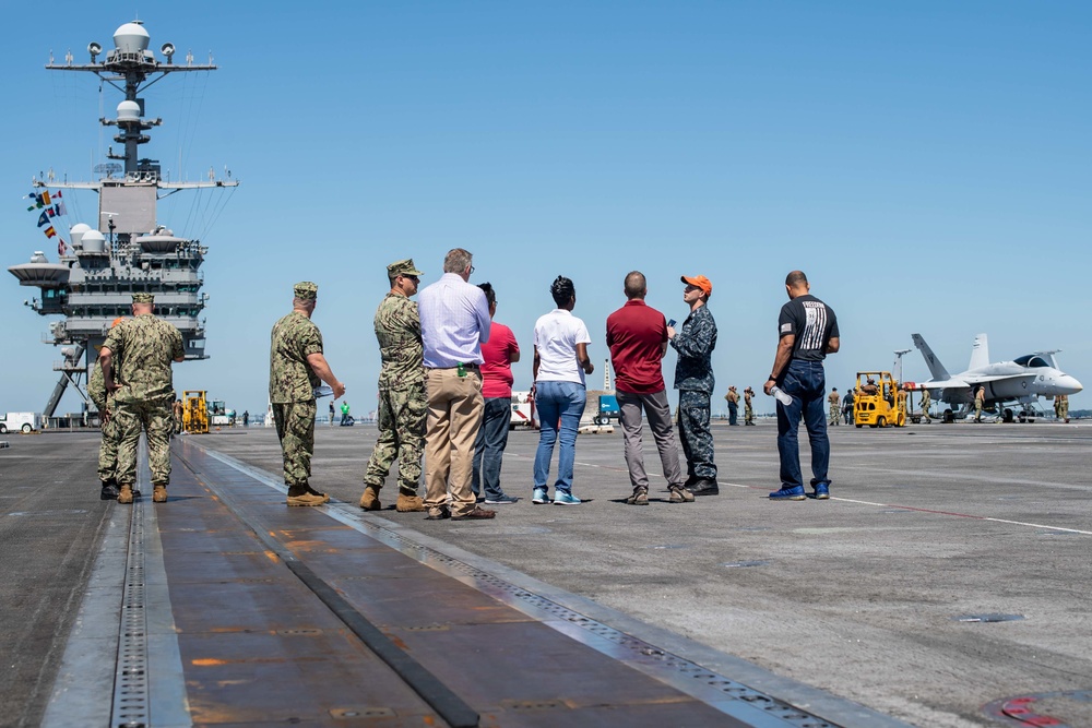 Members from Navy Recruiting Command Educator Orientation tour the aircraft carrier USS John C. Stennis (CVN 74)