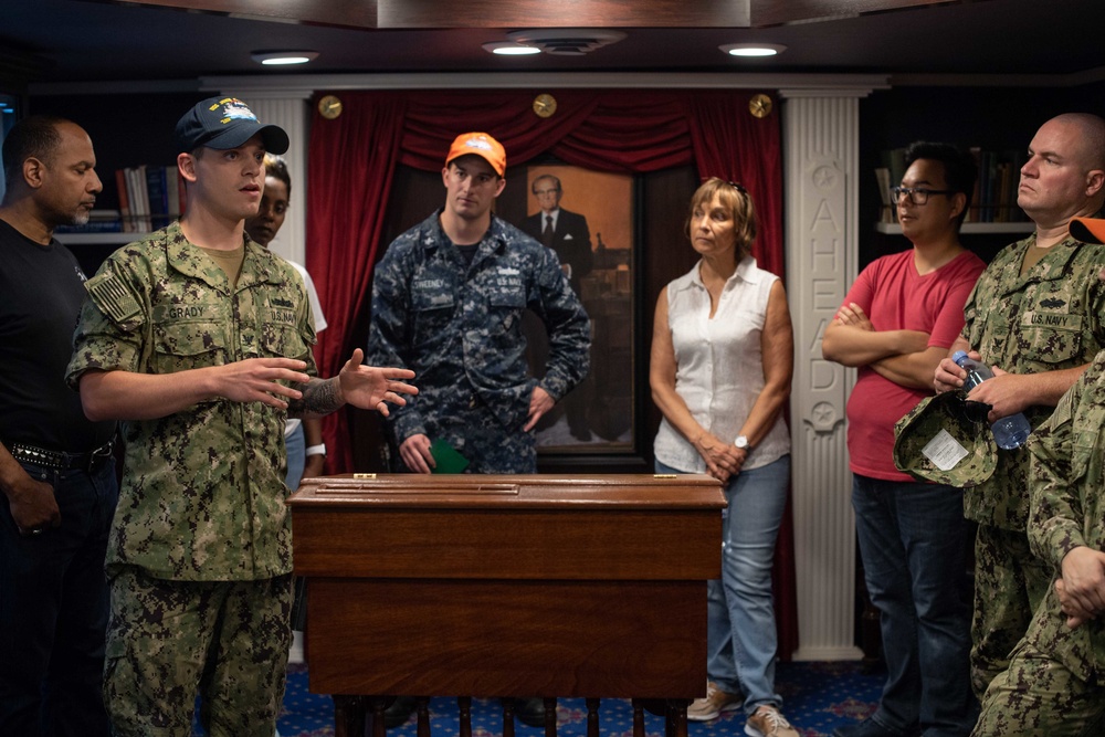 Members from Navy Recruiting Command Educator Orientation tour the aircraft carrier USS John C. Stennis (CVN 74)