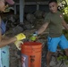 Volunteers remove trash and debris at Makai Research Pier
