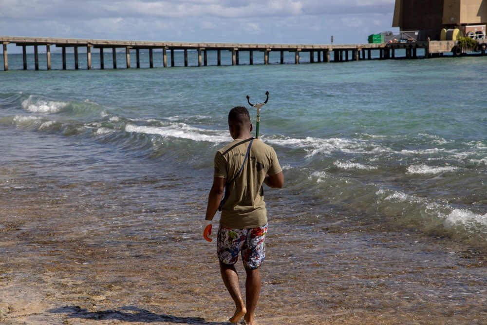 Volunteers remove trash and debris at Makai Research Pier