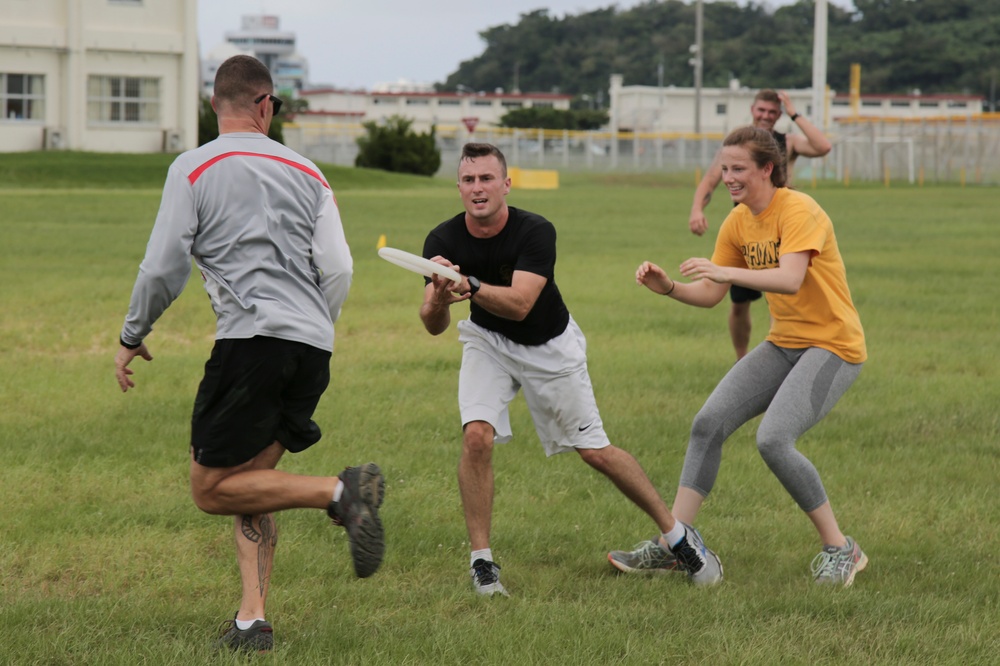 Marines participate in an ultimate frisbee game organized by the Single Marine Program