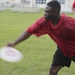 Marines participate in an ultimate frisbee game organized by the Single Marine Program