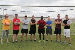 Marines participate in an ultimate frisbee game organized by the Single Marine Program