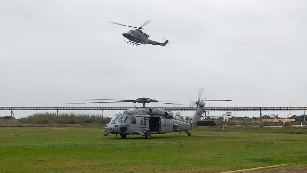 USNS Comfort and HSC 28 Conduct Formation Flight with Peruvian Navy