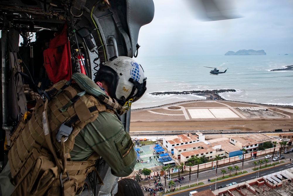 USNS Comfort and HSC 28 Conduct Formation Flight with Peruvian Navy