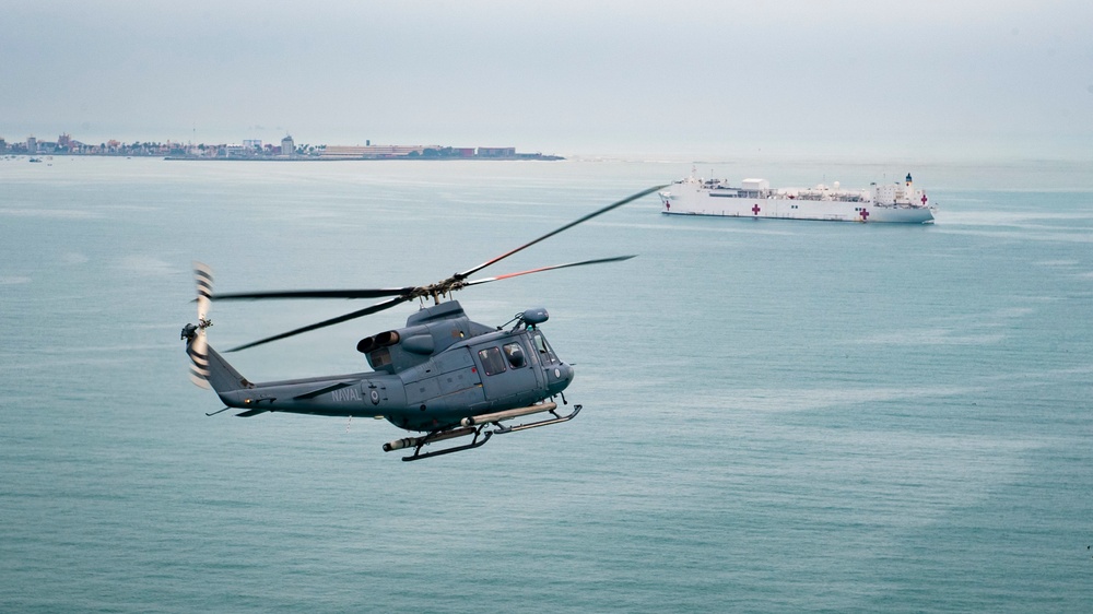 USNS Comfort and HSC 28 Conduct Formation Flight with Peruvian Navy