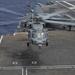 Helicopter Lands On Flight Deck Of Nimitz