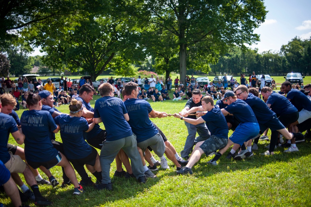 Future Sailors and their recruiters participate in a Family Day event.