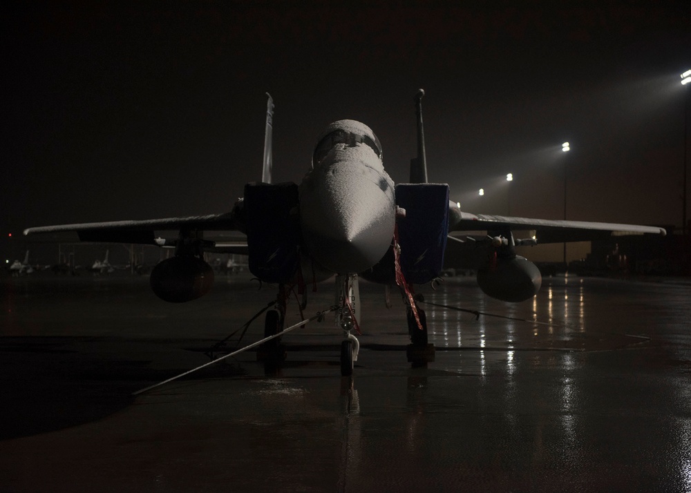 Snow covered F-15C Eagle fighter jet